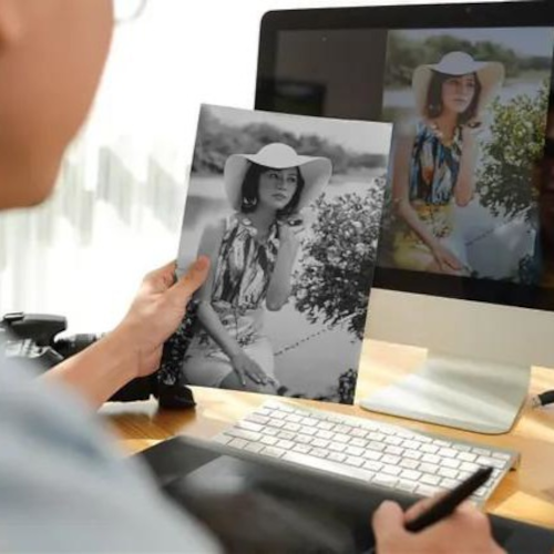 An image of someone retouching an old photograph in photoshop.