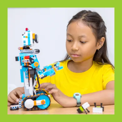 A photo of a girl with a robot built out of LEGO