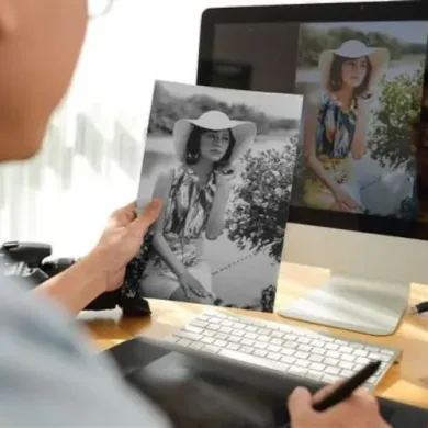 An image of someone retouching an old photograph in photoshop.