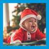 Photo of a baby in a Santa costume